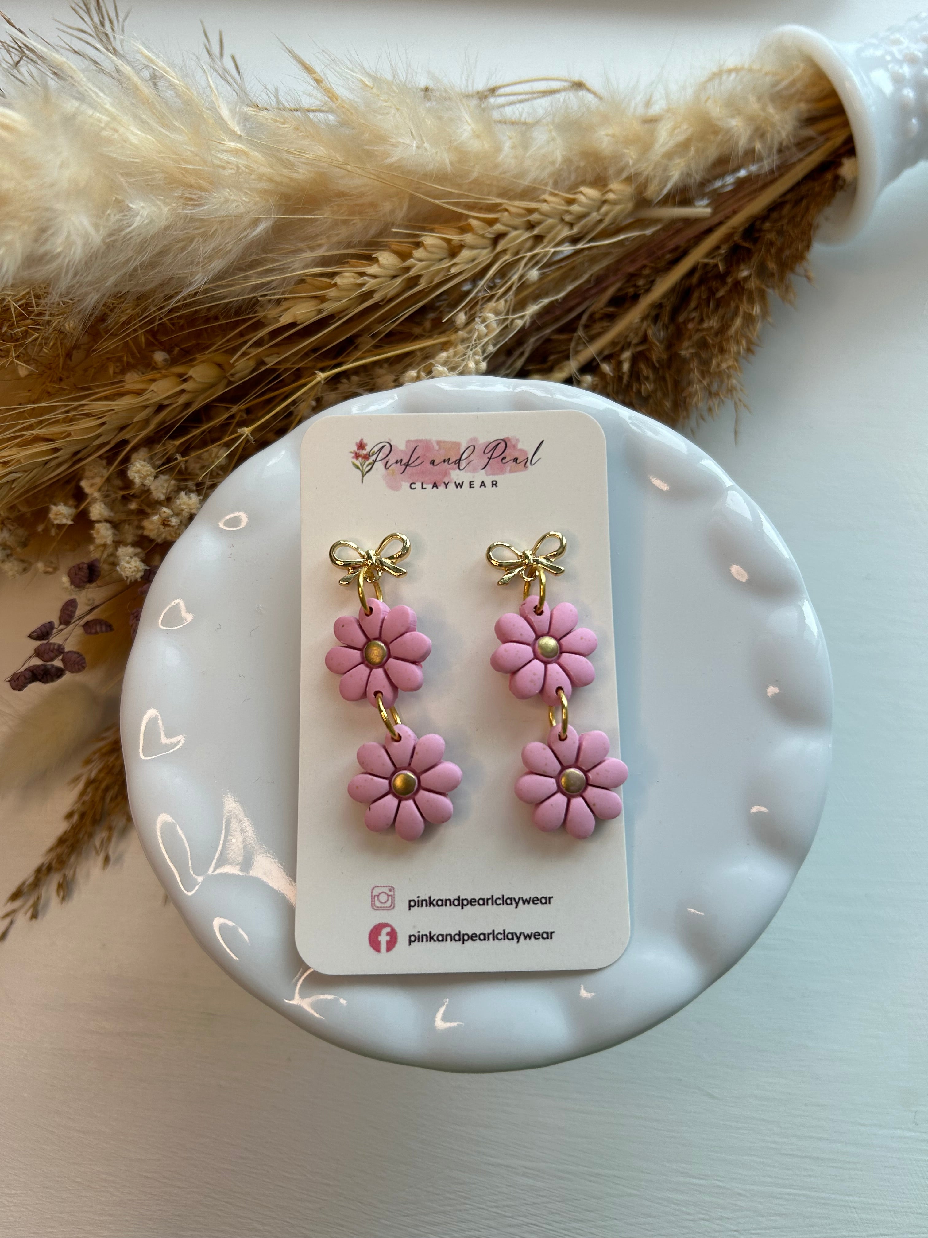 The Iris in pink-bow topper